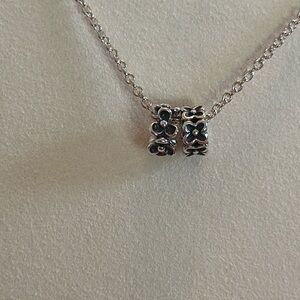 2 Pandora silver spacers.